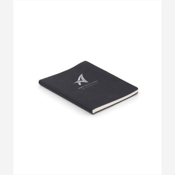 7"x9" Black Leatherette Journal with pen holder on opening side and black ribbon bookmark engraved with silver logo