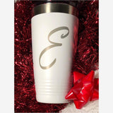 20 oz. white stainless steel tumbler with silver ring at top grips on bottom engraved with 