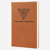 5.25 inch by 8.25 inch tan/brown leatherette journal with black engraving
