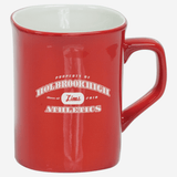 red ceramic coffee mug with white engraving