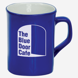 royal blue ceramic coffee mug with white engraving