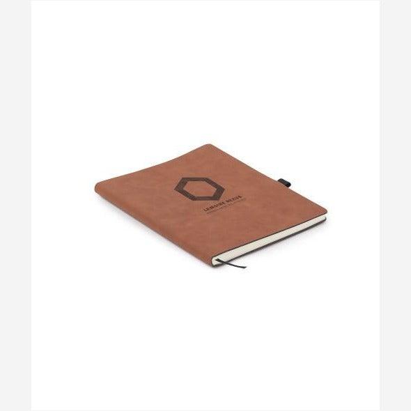 7"x9" Brown Leatherette Journal with pen holder on opening side and black ribbon bookmark engraved with dark brown logo